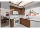 Kitchen with white appliances and wood cabinets at 319 Carrington St, Henderson, NV 89074