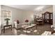 Living room with hardwood floors, furniture, and a large window at 319 Carrington St, Henderson, NV 89074