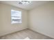 Well-lit bedroom featuring a large window and plush carpeting at 5228 El Pescador Ave, Las Vegas, NV 89108