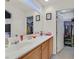 Bathroom with double vanity and a walk-in closet at 6058 Ambleshire Ave, Las Vegas, NV 89139