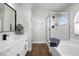 Modern bathroom with soaking tub, walk-in shower, and quartz vanity at 7108 Wild Wave Dr, Las Vegas, NV 89131