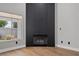 Modern living room fireplace with linear dark wood accent wall at 7108 Wild Wave Dr, Las Vegas, NV 89131