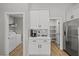 White kitchen cabinets, laundry area, and pantry visible in the background at 7108 Wild Wave Dr, Las Vegas, NV 89131