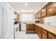 Clean kitchen with white appliances and wood cabinets at 737 Straight St, Las Vegas, NV 89110