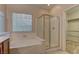 Bathroom features a shower and a bathtub at 8904 Martin Downs Pl, Las Vegas, NV 89131