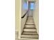 Modern staircase with wood-look vinyl plank treads at 9071 Mount Wilson St, Las Vegas, NV 89113