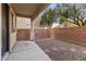 Small, private backyard with gravel and stone pathway at 9490 Swiftwater Ct, Las Vegas, NV 89178