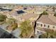 Aerial view of two-story house with solar panels and desert landscaping at 10630 Mount Blackburn Ave, Las Vegas, NV 89166