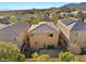 Aerial view of two-story house with solar panels and backyard patio at 10630 Mount Blackburn Ave, Las Vegas, NV 89166