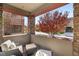 Cozy covered patio with seating area and tree views at 11280 Granite Ridge Dr # 1012, Las Vegas, NV 89135