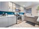 Modern kitchen with gray cabinets, white quartz countertops and farmhouse sink at 1671 Commanche Dr, Las Vegas, NV 89169