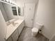 Clean and bright bathroom with white fixtures and updated flooring at 1904 Las Palmas Ln # 203, Laughlin, NV 89029