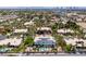 Aerial view of a luxury house with a pool and solar panels, surrounded by other homes at 2209 Purple Majesty Ct, Las Vegas, NV 89117