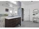 Bathroom with a modern double vanity and large mirror at 2209 Purple Majesty Ct, Las Vegas, NV 89117