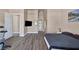 Main bedroom with dark gray bedding and large TV at 2209 Purple Majesty Ct, Las Vegas, NV 89117