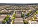 Aerial view of a residential neighborhood with houses and a pool at 2232 Mundare Dr, Henderson, NV 89002