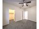 Bedroom with grey carpet, ceiling fan and walk-in closet at 2232 Mundare Dr, Henderson, NV 89002