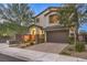 Two-story house with brown garage door and stone accents at 2232 Mundare Dr, Henderson, NV 89002