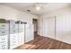 Bright bedroom with wood-look floors and ample closet space at 2683 Regency Cove Ct, Las Vegas, NV 89121