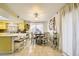 Bright kitchen with yellow cabinets and an eat-in area at 27 Sirnoble St, Las Vegas, NV 89110