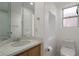 Clean bathroom with corner sink, toilet and a window at 29 Belle La Blanc Ave, Las Vegas, NV 89123