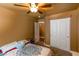 Cozy bedroom with ceiling fan, closet, plush carpet, and natural light at 3508 Pantego Ave, North Las Vegas, NV 89031