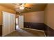 Spacious bedroom with a ceiling fan, carpet flooring, and two-tone paint at 3508 Pantego Ave, North Las Vegas, NV 89031