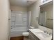 Clean bathroom with a bathtub, shower, and updated vanity at 3945 E Carey Ave, Las Vegas, NV 89115