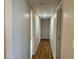 Long hallway with hardwood floors and neutral walls at 3945 E Carey Ave, Las Vegas, NV 89115