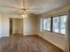 Bright and airy living room with hardwood floors and large windows at 3945 E Carey Ave, Las Vegas, NV 89115