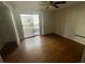 Bedroom with laminate floors and sliding glass door to patio at 4471 Rich Dr # A, Las Vegas, NV 89102