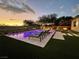 Stunning pool at night with patio and fire pit at 5 Clear Crossing Trl, Henderson, NV 89052