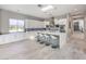 Modern kitchen with white cabinets, large island, and skylight at 5 Clear Crossing Trl, Henderson, NV 89052