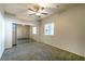 Bright bedroom with mirrored closet doors and carpet at 5250 S Rainbow Blvd # 1101, Las Vegas, NV 89118