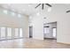 Sunlit living room with hardwood floors, high ceilings, and access to a backyard patio at 5396 Splendido Ave, Pahrump, NV 89061