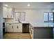 Modern kitchen with white cabinets and quartz countertops at 5746 Wind Dancer Dr, Las Vegas, NV 89118