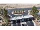 Community entrance with guardhouse and palm trees at 5900 Ablette Ave, Las Vegas, NV 89122