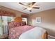 Guest bedroom with a ceiling fan and comfortable bed at 7306 Puckershire St, Las Vegas, NV 89166