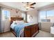 Bright bedroom with wooden sleigh bed and ample window light at 7306 Puckershire St, Las Vegas, NV 89166