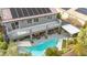 Aerial view of house with solar panels and refreshing pool at 7306 Puckershire St, Las Vegas, NV 89166