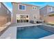 Home with private backyard featuring a refreshing pool at 7450 Tinley Creek Ave, Las Vegas, NV 89113