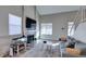 Living room features a gray sofa, fireplace, and fish tank at 814 Crabapple Dr, Henderson, NV 89002