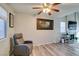 Relaxing living area with gray recliner and wood floors at 814 Crabapple Dr, Henderson, NV 89002