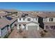 Two-story house with solar panels, landscaping, and mountain views at 9598 Medway Towns Ave, Las Vegas, NV 89178