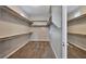 Spacious walk-in closet with ample shelving and hanging space at 10148 Rockridge Peak Ave, Las Vegas, NV 89166