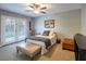 Guest bedroom with french doors leading to backyard at 1568 Seneca Ln, Las Vegas, NV 89169