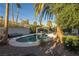 Inviting kidney shaped pool with pergola and lounge area at 1568 Seneca Ln, Las Vegas, NV 89169