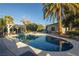 Inviting kidney-shaped pool with a pergola and ample patio space at 1568 Seneca Ln, Las Vegas, NV 89169