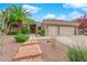 Front entry with a stone walkway leading to the house at 1700 Saint Gregory Dr, Las Vegas, NV 89117