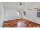 Hardwood floors and ceiling fan in this bedroom at 3005 Fern Hollow Ct, Las Vegas, NV 89108